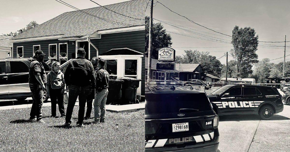 Law enforcement vehicles and officers outside a residence in Shreveport following a mass shooting that left eight children dead.