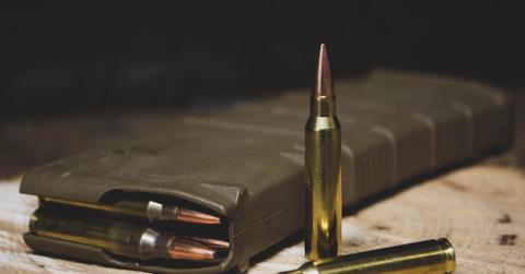 two men exchange gunfire after argument year old bystander shot and killed