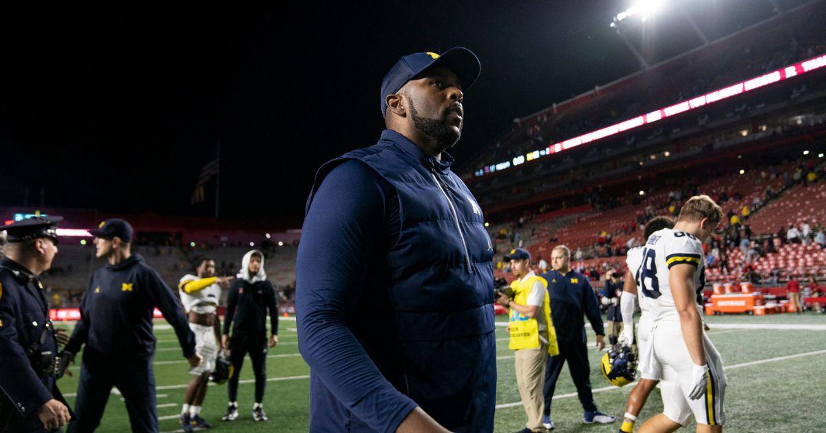 Sherrone Moore on the football field during his time as Michigan coach, prior to the case that resulted in probation