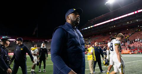 Sherrone Moore on the football field during his time as Michigan coach, prior to the case that resulted in probation
