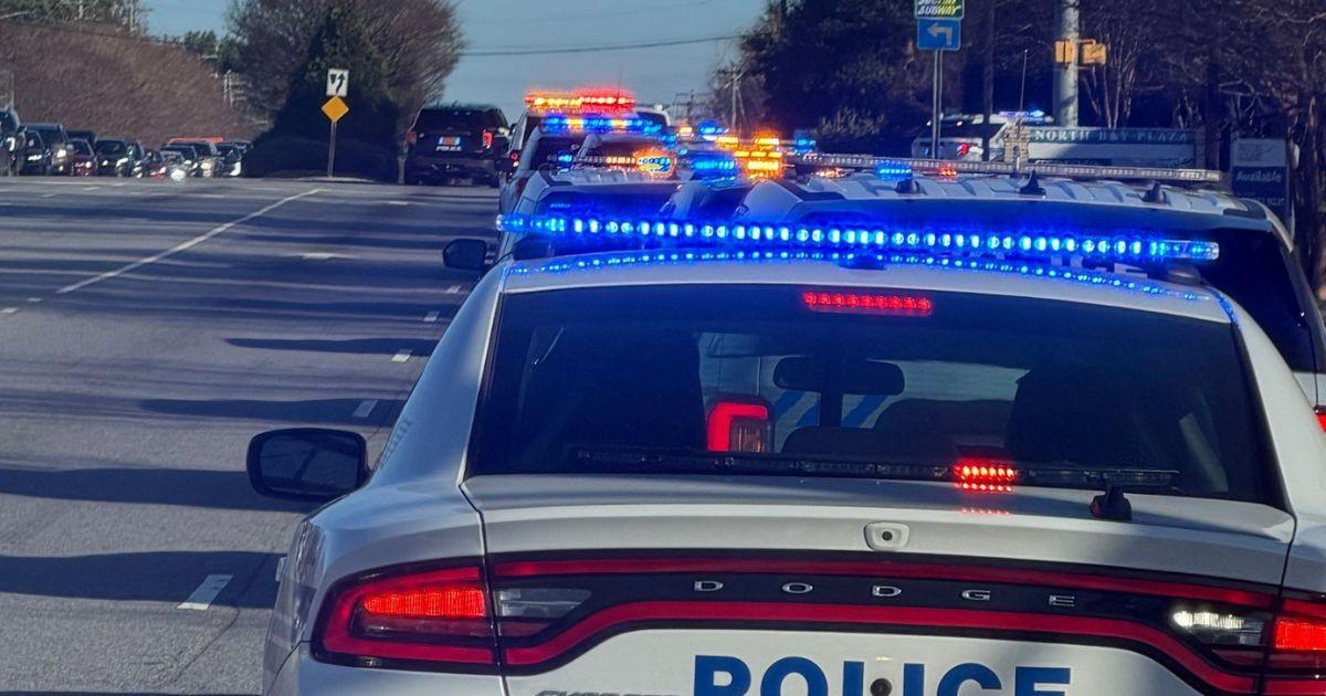 Police lights at night following a fatal crash during an Alabama state trooper pursuit