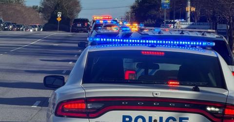 Police lights at night following a fatal crash during an Alabama state trooper pursuit