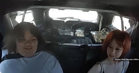 Video still shows two Florida teens accused of plotting a classmate’s killing sitting in a police patrol car.